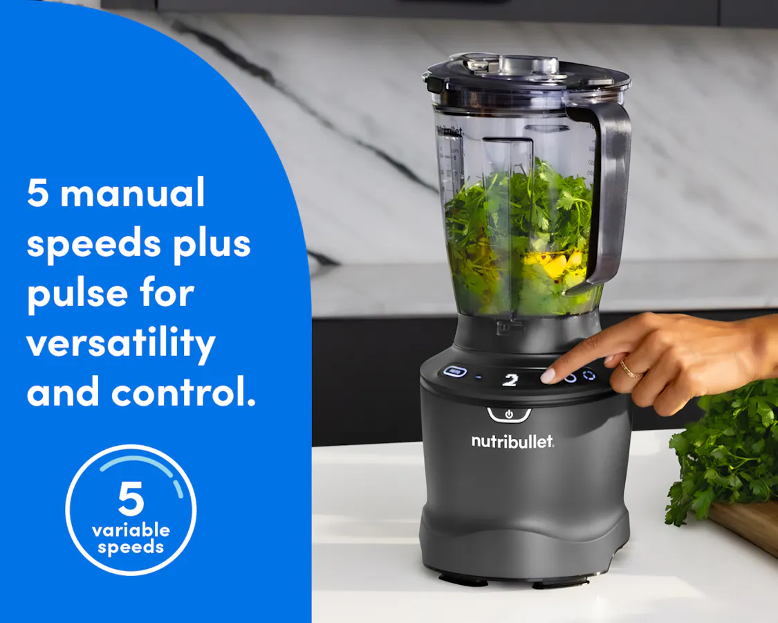 The smartSense Blender is shown filled with greens on a marble countertop. A finger is adjusting the blender speed. The blue panel to the left of the image reads "5 manual speeds plus pulse for versatility and control."