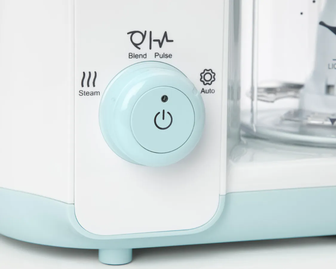 Close up of the dial on the baby steam and blend on a white background