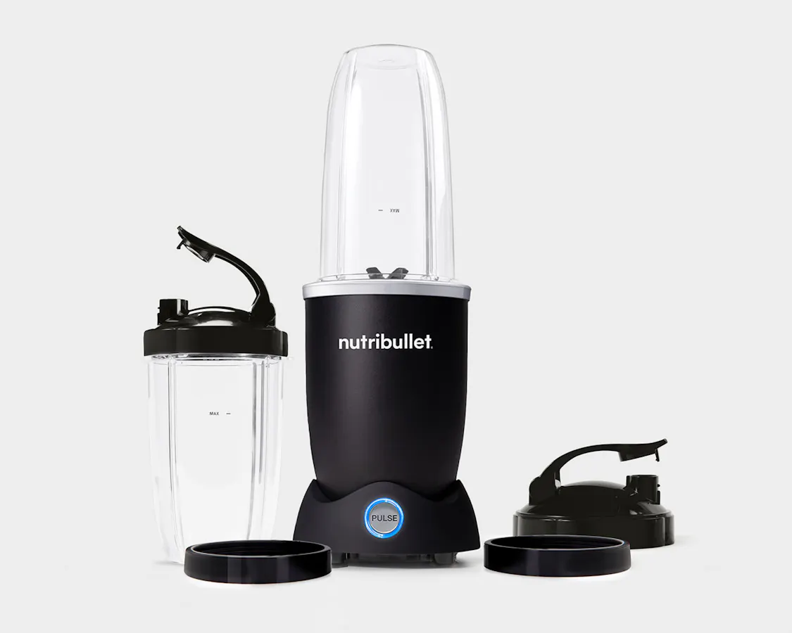 empty matte black nutribullet pro plus with cups and lid on a grey background