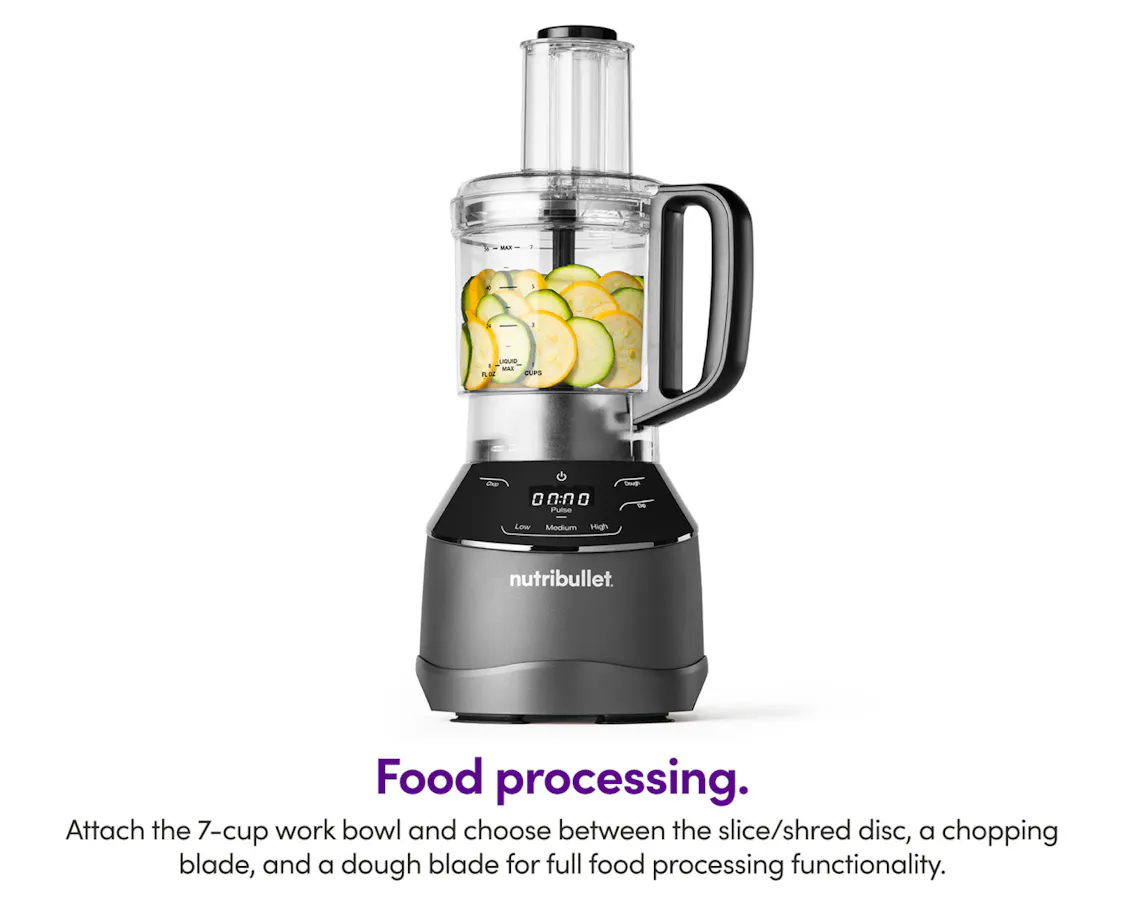Food processor and base of nutribullet Triple Prep, filled with cucumbers