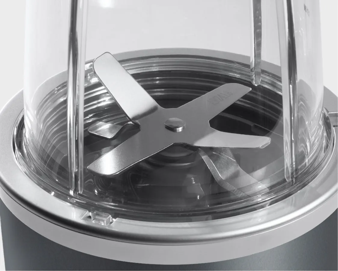 nutribullet original extractor blade closeup on grey background.