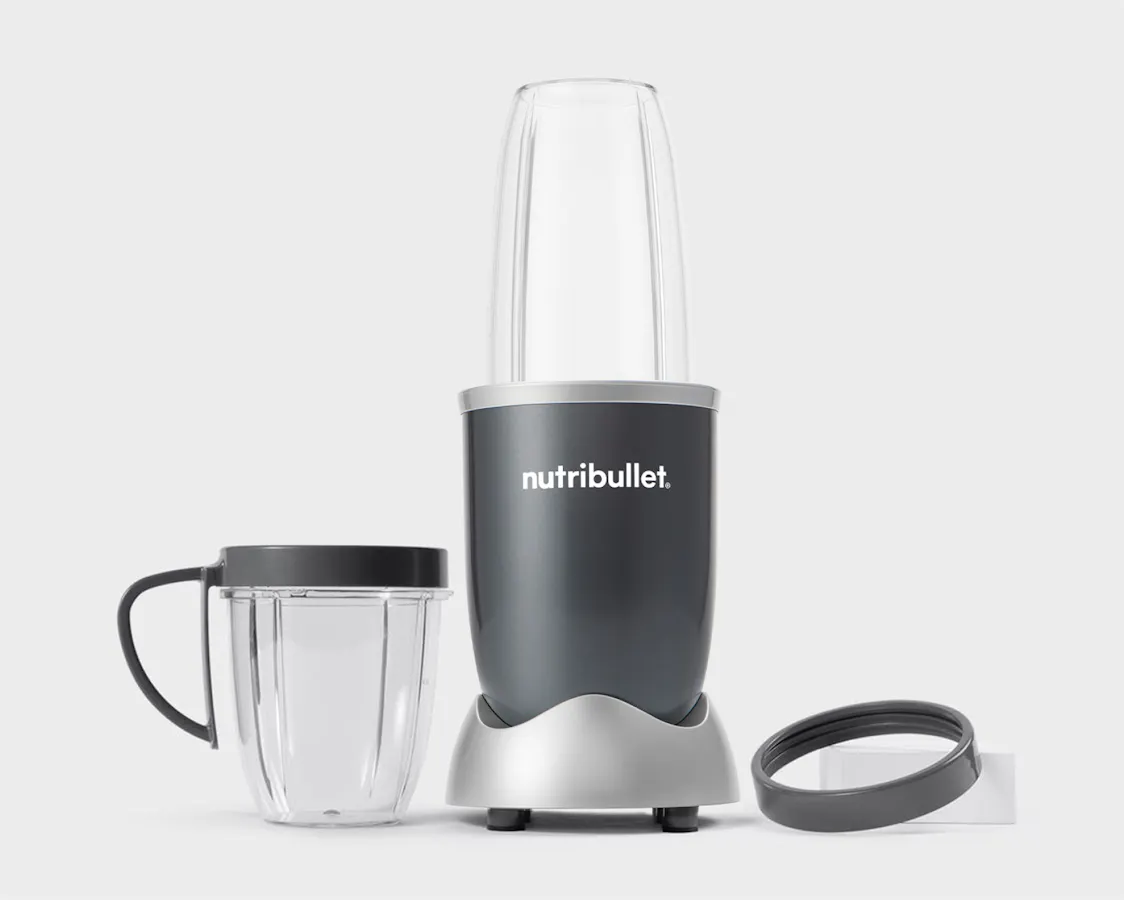 nutribullet original with cup and comfort lip ring on grey background.